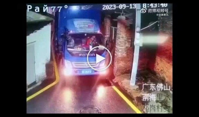 A Chinese truck driver navigates a route through a bottleneck.