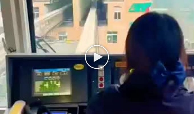 In China, a high-speed tram passes through a 19-story residential building