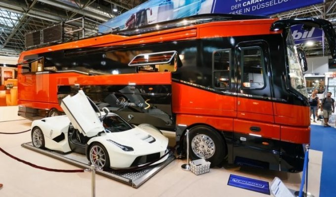 The most expensive motorhome of 2022 has a place to store a Ferrari supercar and a roof terrace (9 photos + 1 video)
