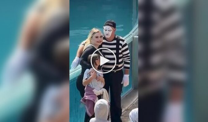 A mime troll from an oceanarium: like a man Entertains tourists