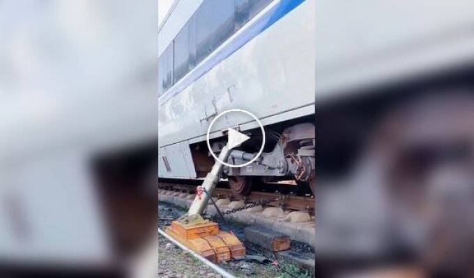 Lifting a derailed train car with a powerful jack