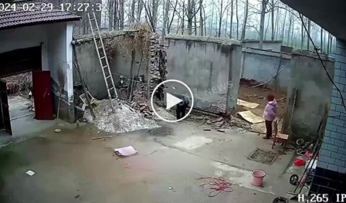 A collapsed wall nearly crushes a man