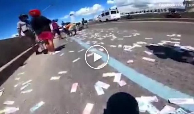 A fortune spilled out of a motorcyclist's backpack onto a busy highway