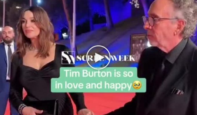 Looks like a teenager in love. Tim Burton kissing Monica Bellucci is being discussed online