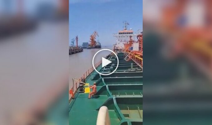 Using a powerful slingshot to launch a rope from a tanker