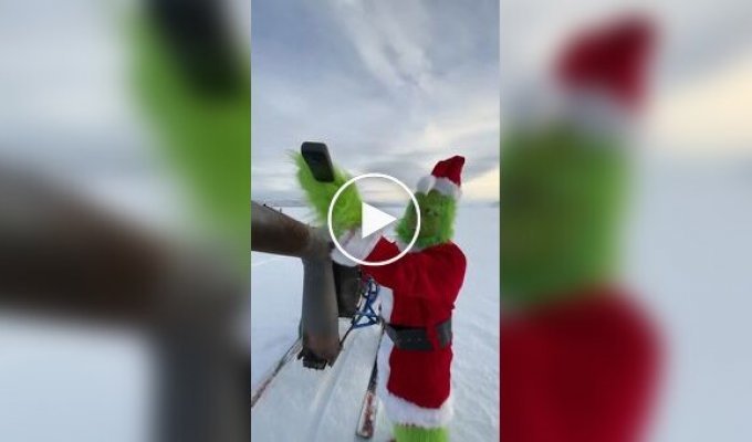 Engineer cosplays the Grinch on a jet sled