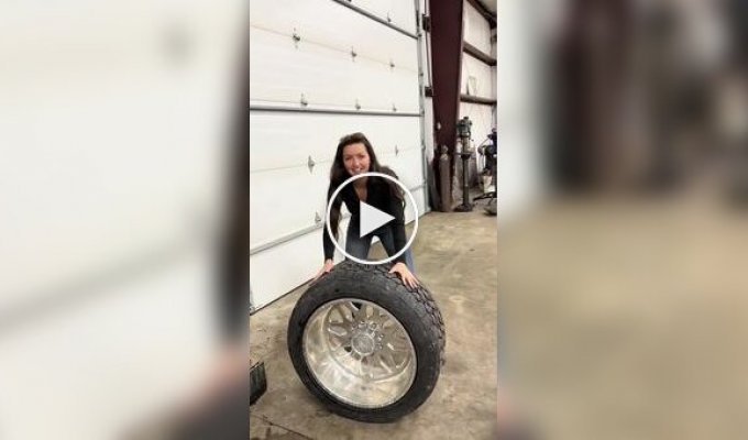When a girl decided to help a guy change his tires