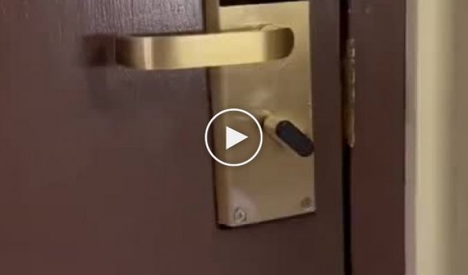 Thief with an interesting device for breaking into a hotel room