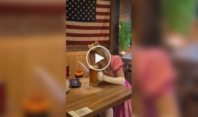 A girl dressed as a princess drank a glass of beer in 9 seconds