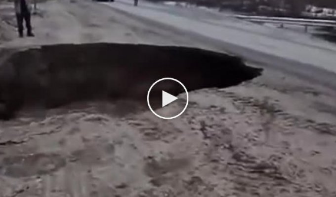 In the Murmansk region, a section of the road was washed away by a stream of water