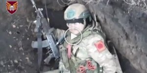 A liquidated Russian invader burns in a trench in the Donetsk region