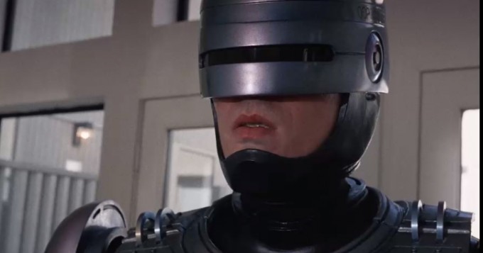 Why is RoboCop's lower face exposed? Why aren't they shooting at her? (6 photos)